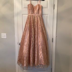 This is a princess strapless dress , rose gold / dashed with glitter all around.